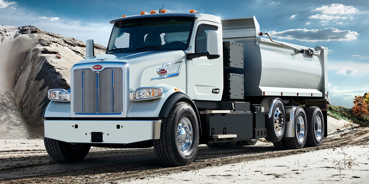 A Peterbilt 567EV on a jobsite